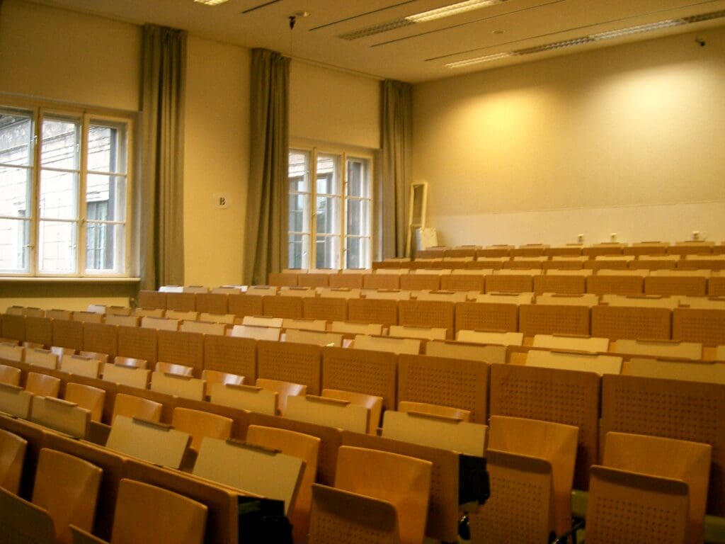 University classroom with wooden fold down chairs