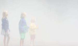 Three children in blurry weather
