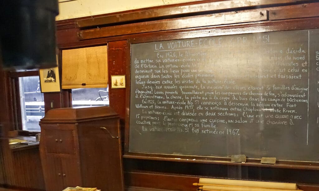 Blackboard in older classroom with french writing in chaulk