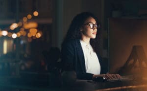 Office, business and woman on computer for research, project management and online documents. Corporate manager, vision and female worker working on strategy, planning and reading website