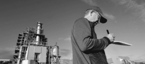 Ben Parfitt taking notes outside a new pellet-burning thermal electricity plant in Japan, north of the city of Sendai. Photo: Conservation North.
