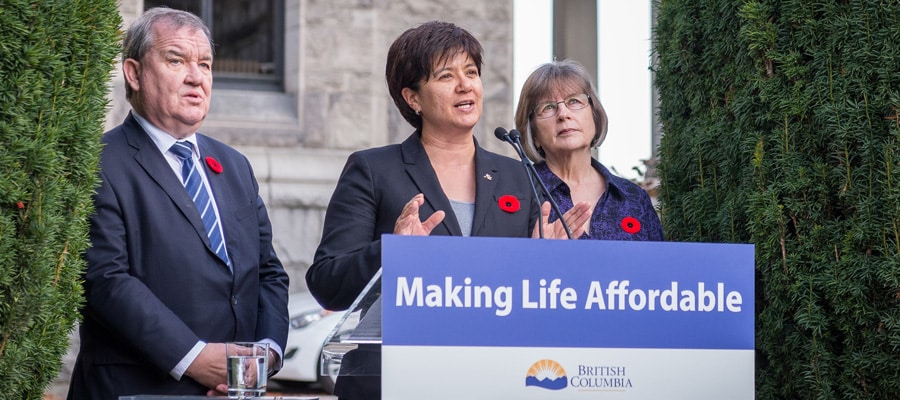 Photo: Minister of Social Development and Poverty Reduction Shane Simpson, Parliamentary Secretary for Poverty Reduction Mable Elmore and School of Social Work at UNBC chair Dawn Hemingway announcing the members of the Advisory Forum on Poverty Reduction, October 30, 2017. <a target="_blank" href="https://www.flickr.com/photos/bcgovphotos/38014093332/">Province of BC</a> / Flickr” style=”border-radius:0px;–objectFit:cover;–imagePosX:50%;–imagePosY:50%” decoding=”async” srcset=”https://www.policyalternatives.ca/wp-content/uploads/2025/04/PN_oct2017_SixStepsPoverty.jpg 900w, https://www.policyalternatives.ca/wp-content/uploads/2025/04/PN_oct2017_SixStepsPoverty-300×133.jpg 300w, https://www.policyalternatives.ca/wp-content/uploads/2025/04/PN_oct2017_SixStepsPoverty-768×341.jpg 768w” sizes=”(max-width: 900px) 100vw, 900px” /></div><div  class=