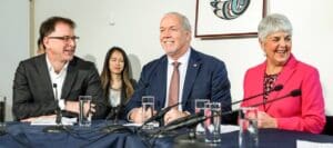 In Dec 2019 Premier John Horgan, Minister Carole James and Minister Adrian Dix gathered to celebrate the end of MSP premiums in BC, effective Jan 1, 2020. Credit: Province of BC/Flickr