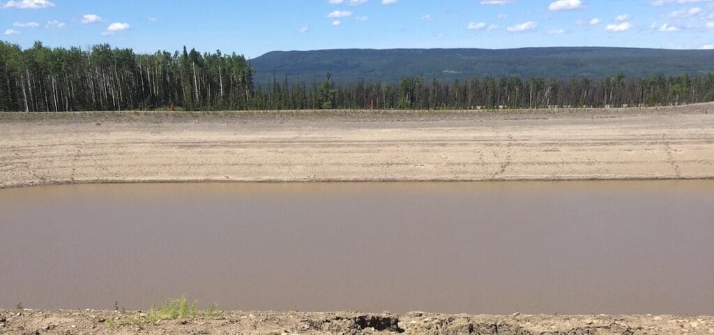 Image: The 20-million-gallon Lily Dam, one of the two unlicensed dams for which Progress Energy received retroactive exemption from environmental review. Photo by Ben Parfitt.