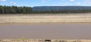 Image: The 20-million-gallon Lily Dam, one of the two unlicensed dams for which Progress Energy received retroactive exemption from environmental review. Photo by Ben Parfitt.