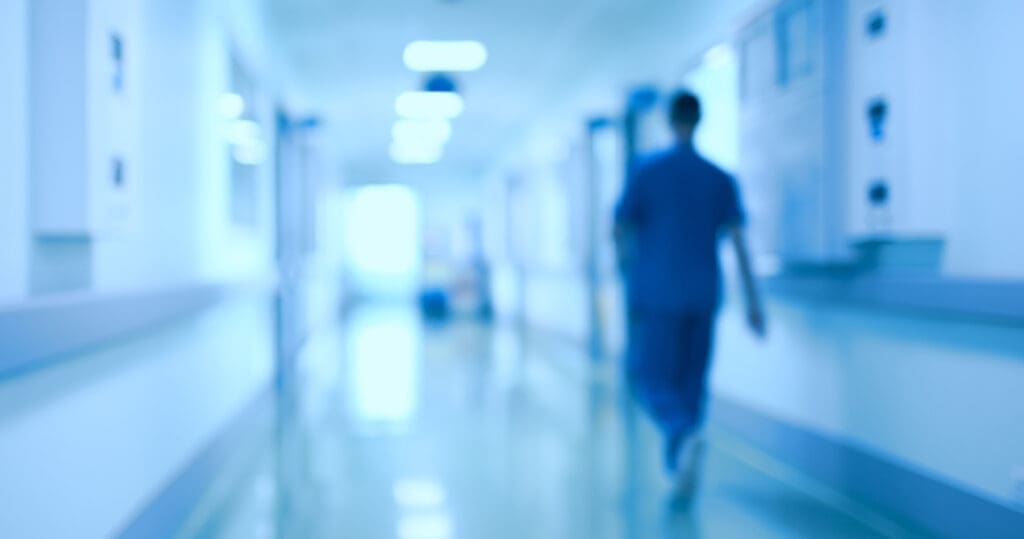 Hospital corridor and doctor as a blurred defocused background