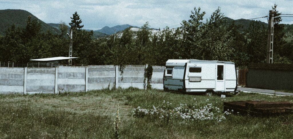 White trailer in empty field.