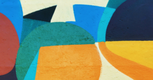 abstract painting with orange, blues, and greens.