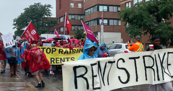 Members of Unifor union protesting at a rent strike in Ontario, Canada