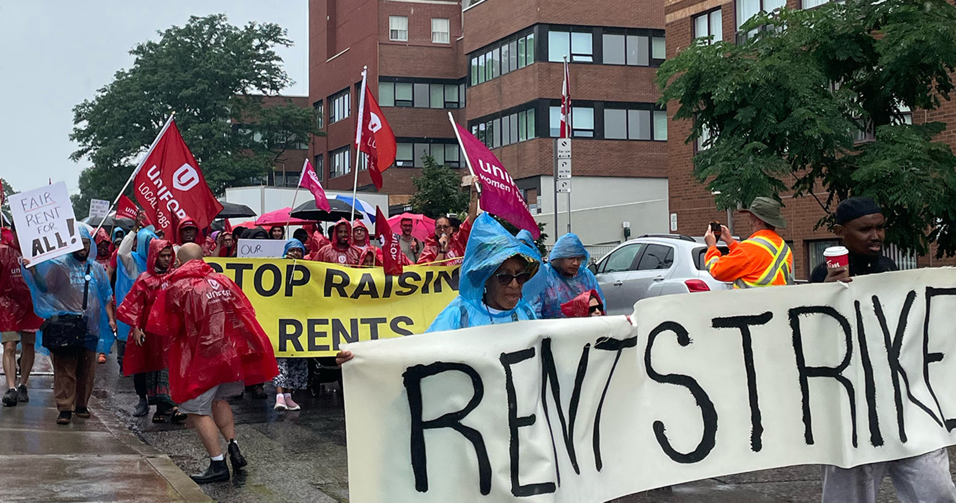 Members of Unifor union protesting at a rent strike in Ontario, Canada
