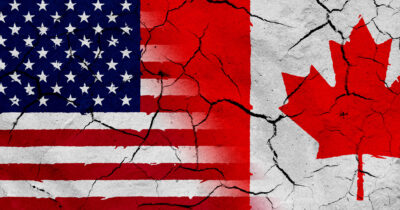 half of an American flag next to half of a Canadian flag
