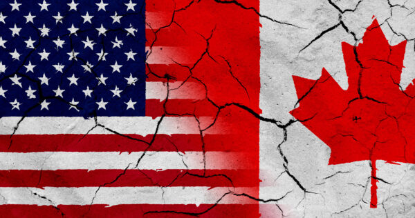 half of an American flag next to half of a Canadian flag