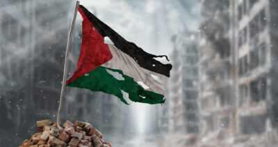 The Palestinian flag ripped up in rubble