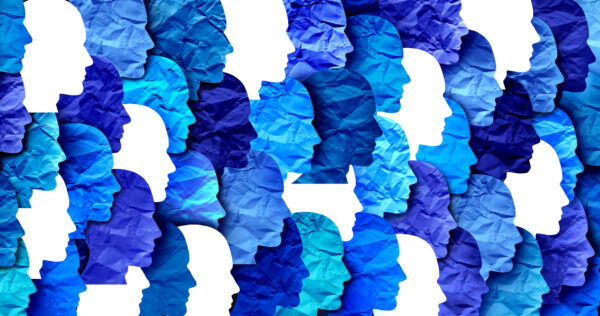 Bunch of different coloured cut out faces arranged in a grid